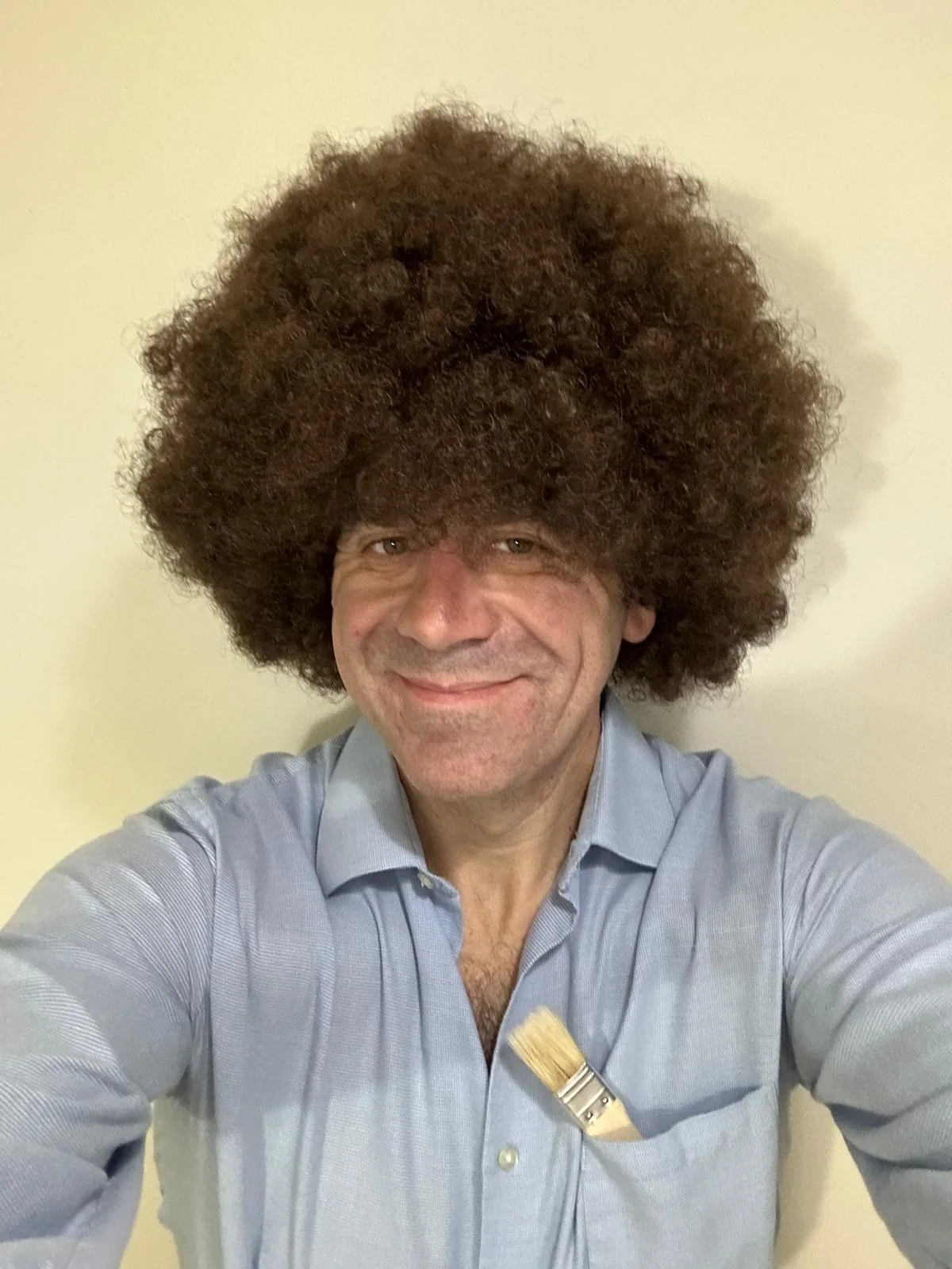 Brian Tort in a playful Bob Ross costume